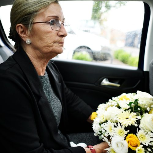 Sad widow on the way to th funeral